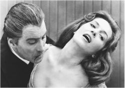 Dracula biting woman's neck