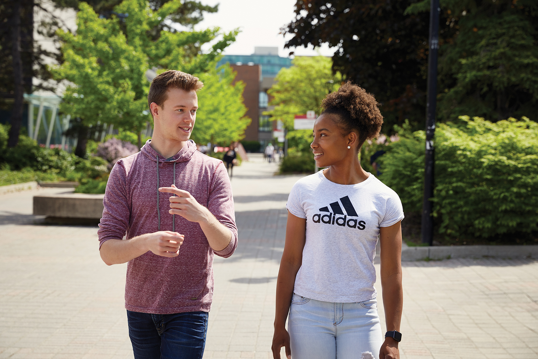 Two students walking on campus