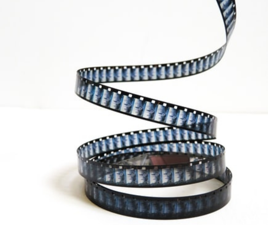 A black film strip spiraled on a white background 
