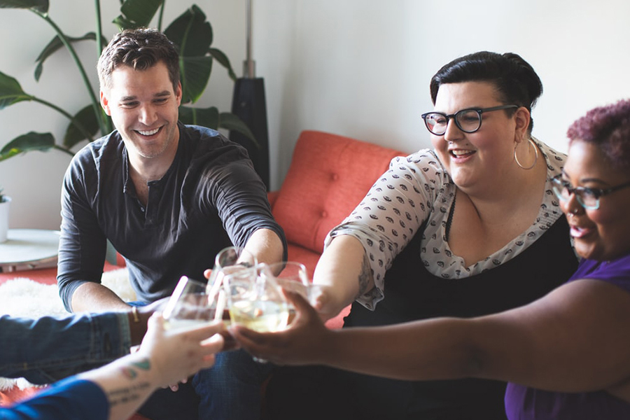 Group of friends clinking glasses