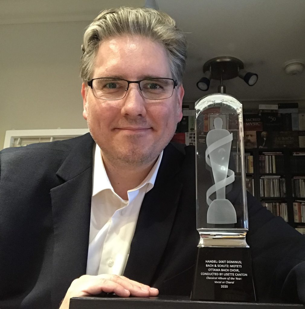 York alumnus, John Holland (PhD '18) poses with his JUNO award.