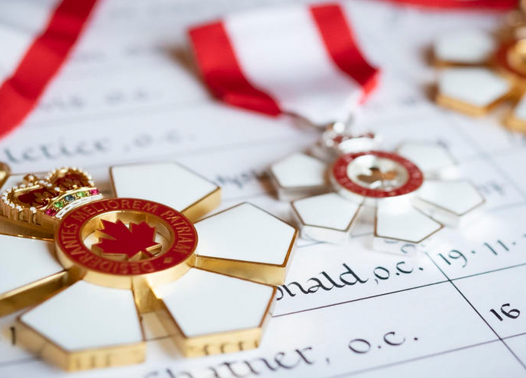 Order of Canada insignia laid out on list of recipients