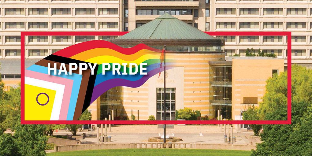 Happy Pride banner. Illustrated 2SLGBTQIA+ flag overlayed on a photo of Vari Hall.