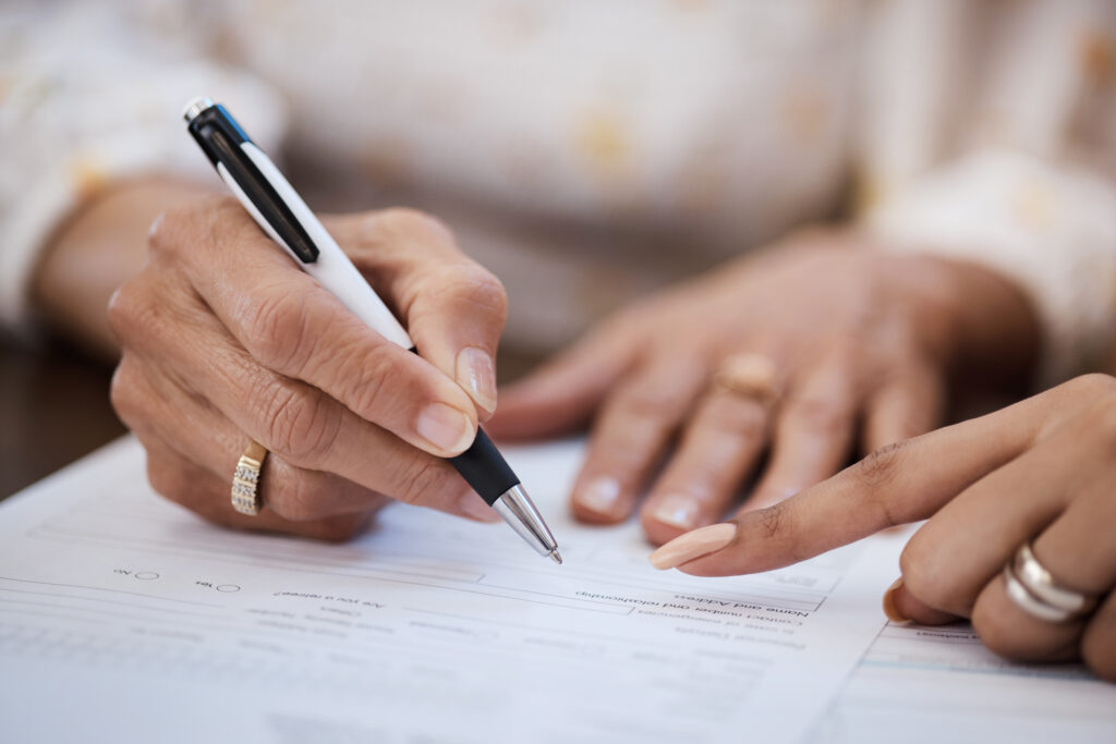 person signing a document 