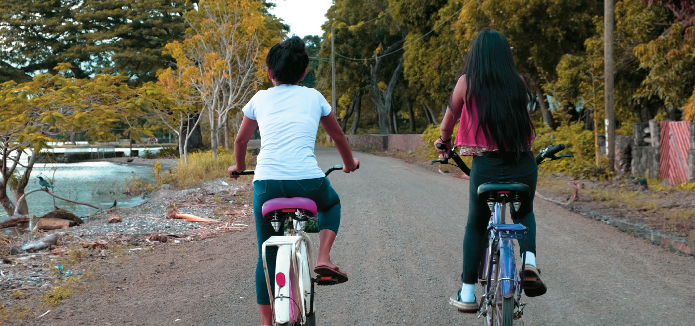 Two girls bicycling