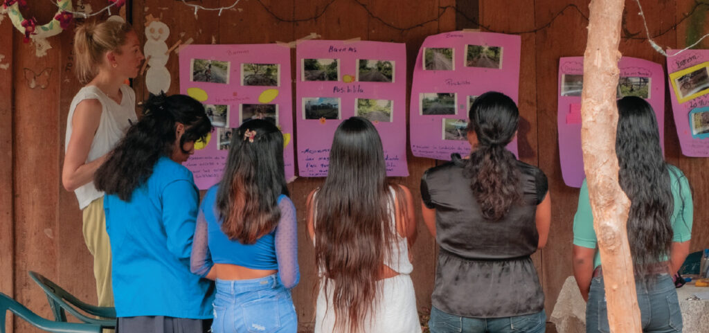 Hayhurst co-facilitating a poster collaging workshop as part of the study with Nicaraguan collaborators.