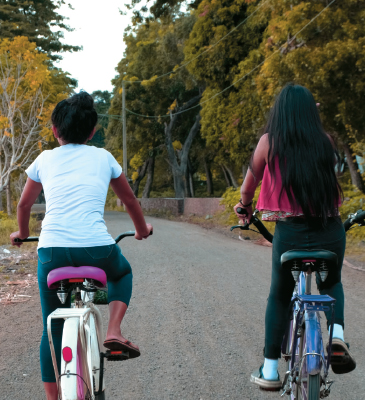 Two girls riding bicycles