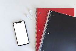 Phone-red-and-black-notebooks-flatlay-1