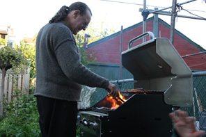 [Laurence setting a steak on fire]