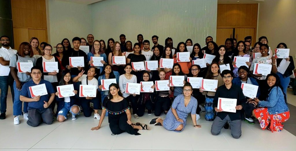 Students posing together with their FPLT certificates