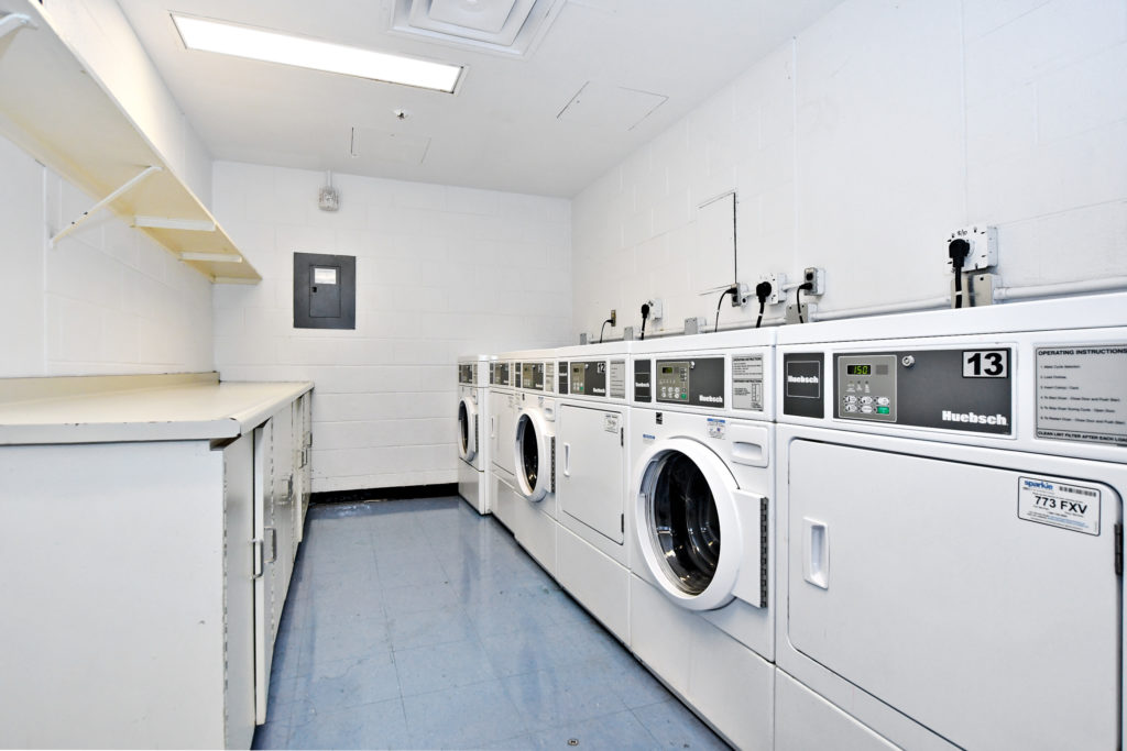 A laundry room showing 3 washers and 3 dryers.