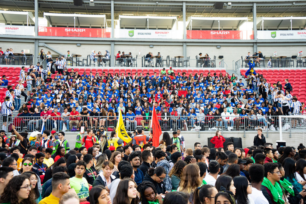 People seated in a stadium.