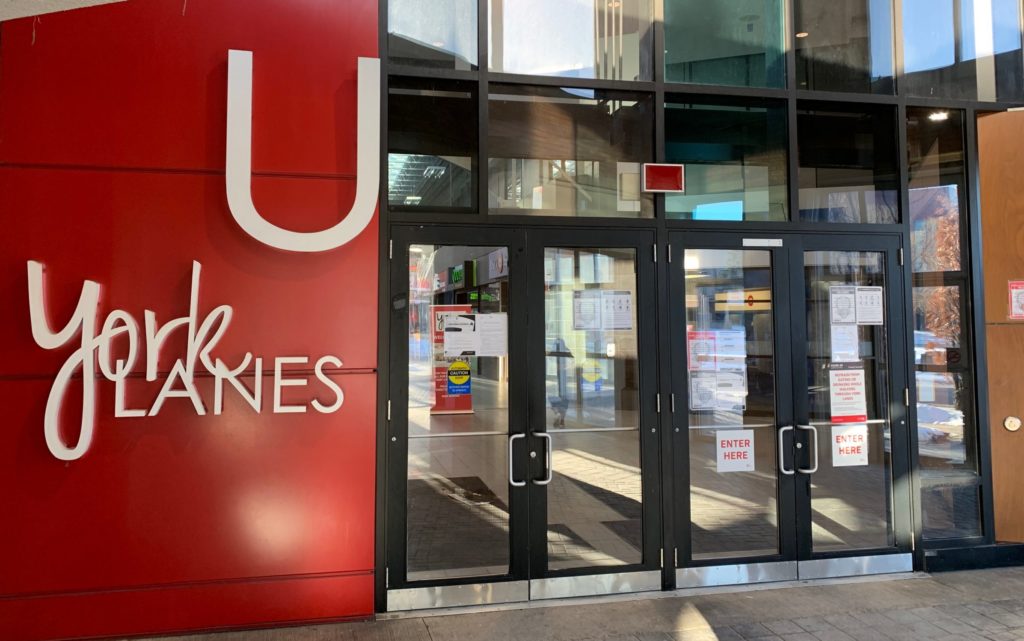 Glass doored entrance beside sign reading "York Lanes"