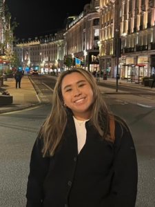 Girl smiling at camera in fall