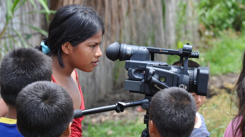 young woman using a camera