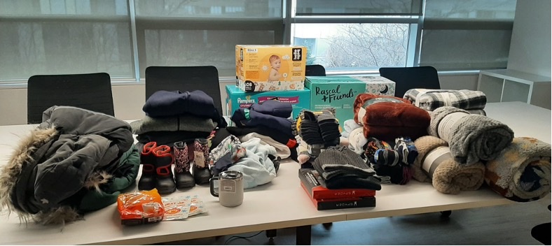 donations collected - boots, jackets, blackets, diapers, other necessities