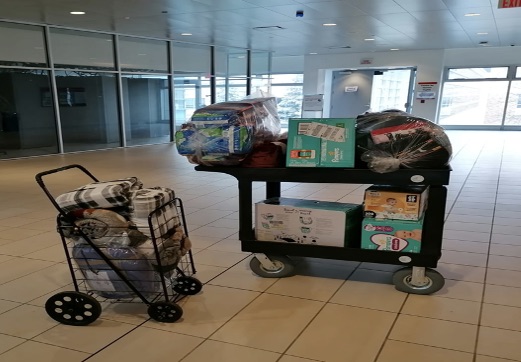 donations loaded onto a cart preparing to be delivered