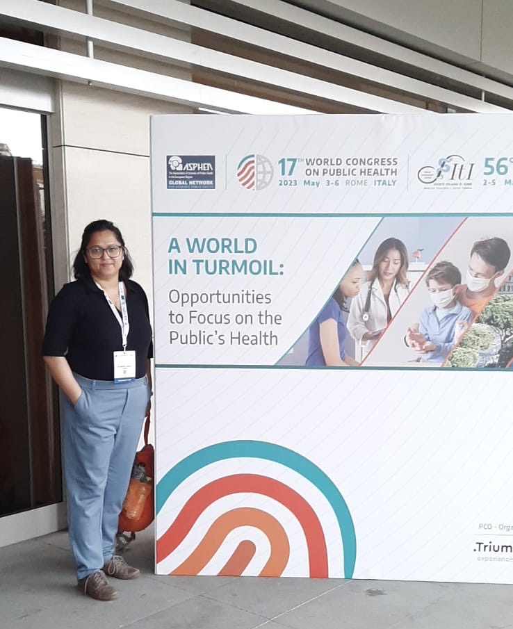 Nell standing next to WCPH Banner
