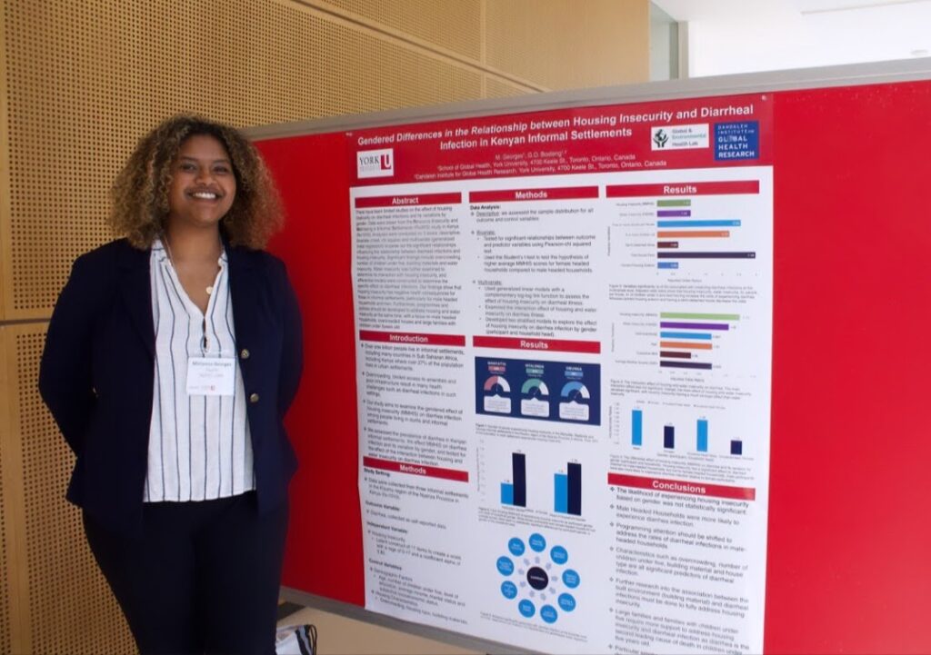A picture of  Mirianna Georges with her research project 