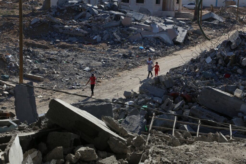 A picture that shows situations of Gaza: destroyed buildings and people walking