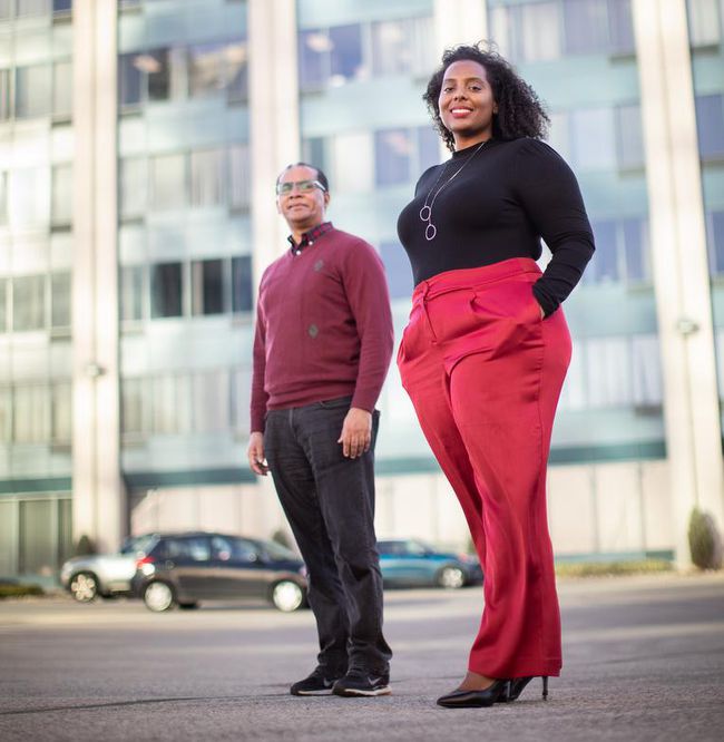 image of Amanuel Melles, executive director for the Network for the Advancement of Black Communities, left, and Agapi Gessesse, executive director of the CEE Centre for Young Black Professionals standing in front of a building in downtown Toronto. 