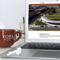 Laptop and coffee mug on a table