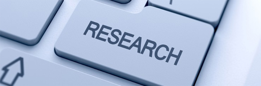 laptop keyboard highlighting a key with the word RESEARCH