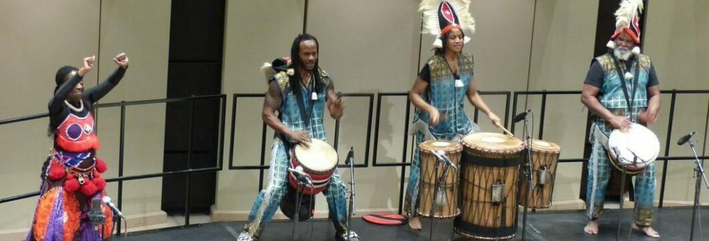 Education alumna Collette Murray and 3 drummers performing at the Word, Sound, Power: A celebration of Black Artistic Expression event