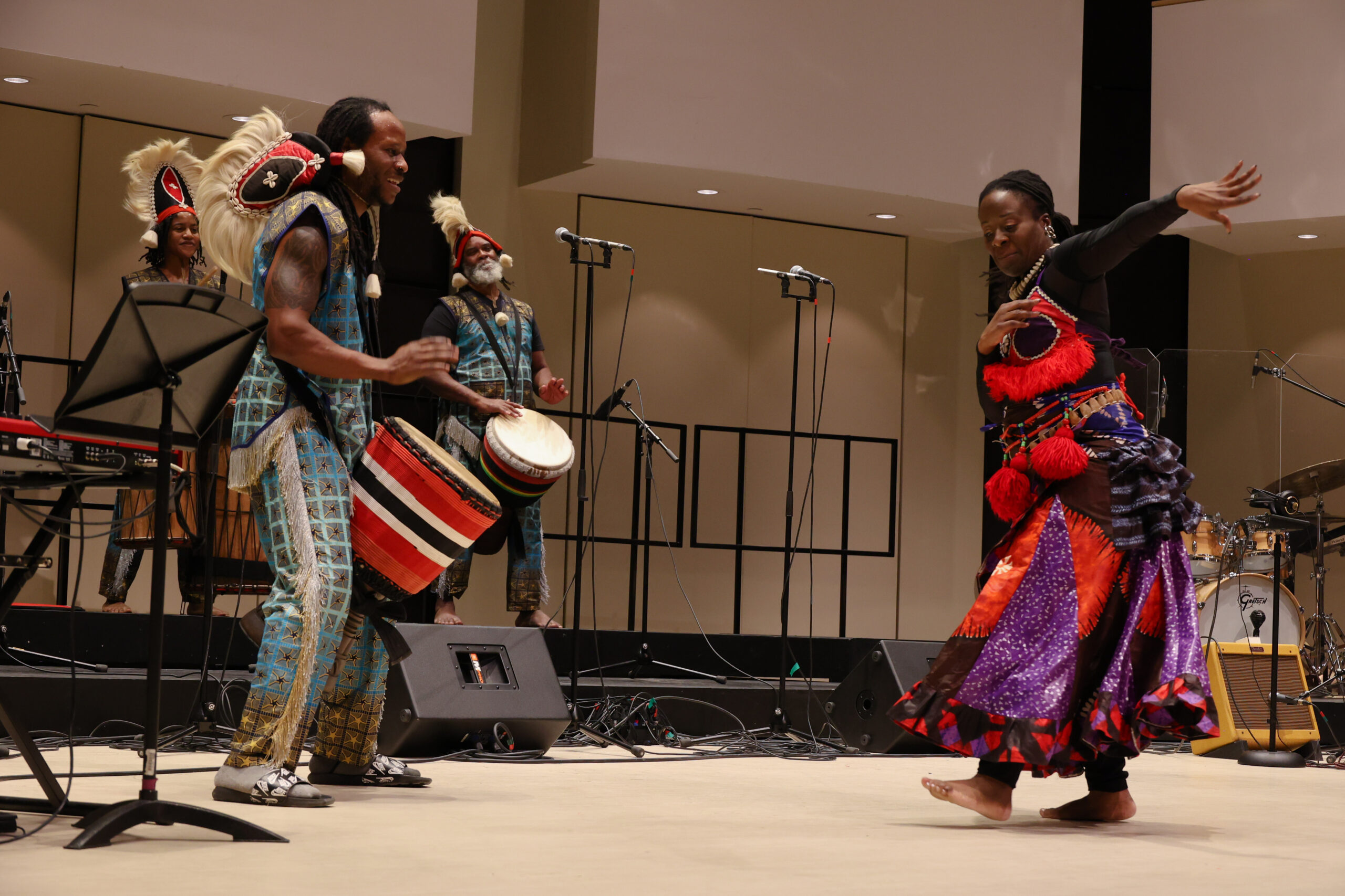 Coco Murray and 3 drummers performing at Word, Sound, Power event