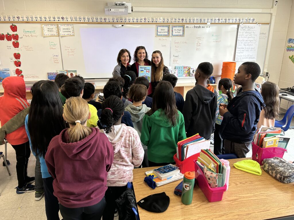 pictured from left to right: Anne Schlarp (Practicum facilitator), Vickie Morgado (St. Philip-DPCDSB Mentor teacher), Victoria Tymchii (teacher from Ukraine) with grade 4 students from St. Philip Elementary School (DPDSB)