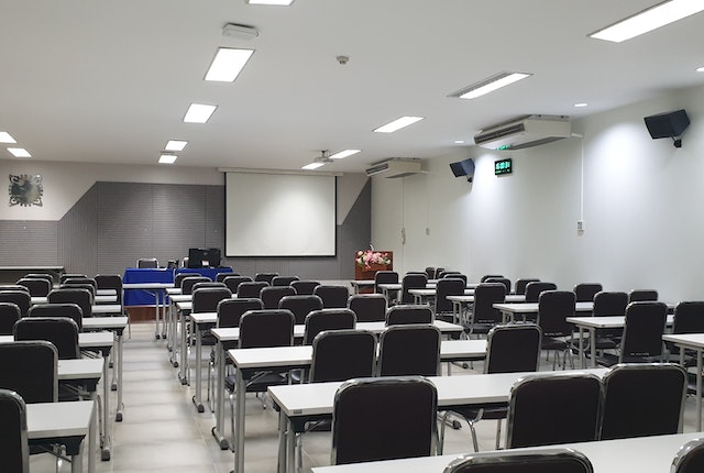 An Empty Tables and Chairs Inside the Classroom