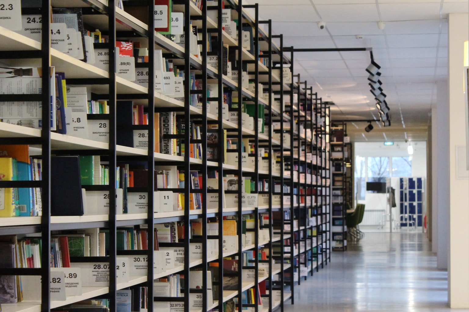 A photo of stack of books in shelf