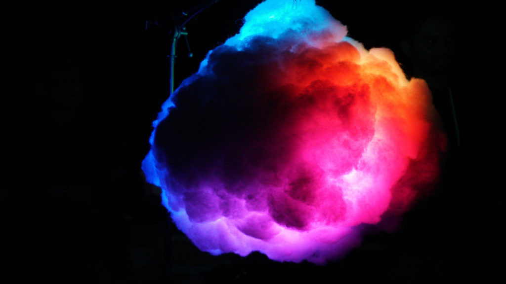 photo of a multi-coloured billowing cloud of smoke