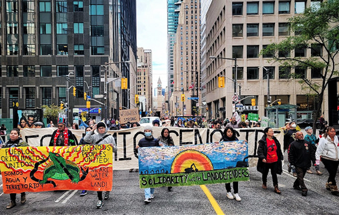 A protest in the streets of Toronto to march with Indigenous land defenders fighting off TC Energy's pipelines.