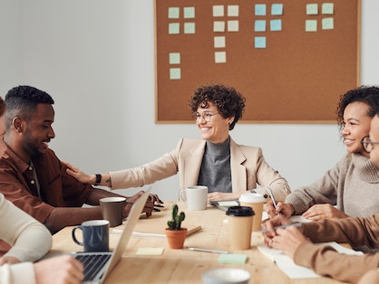 An image of happy colleagues working together