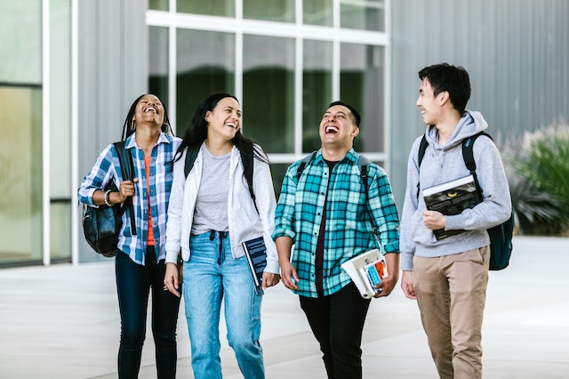 Image of a group of students walking and laughing together