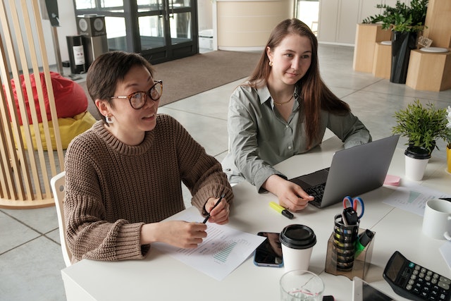 Photo of women talking in an office