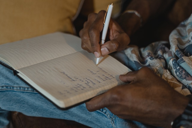 Close-Up of a Person Writing