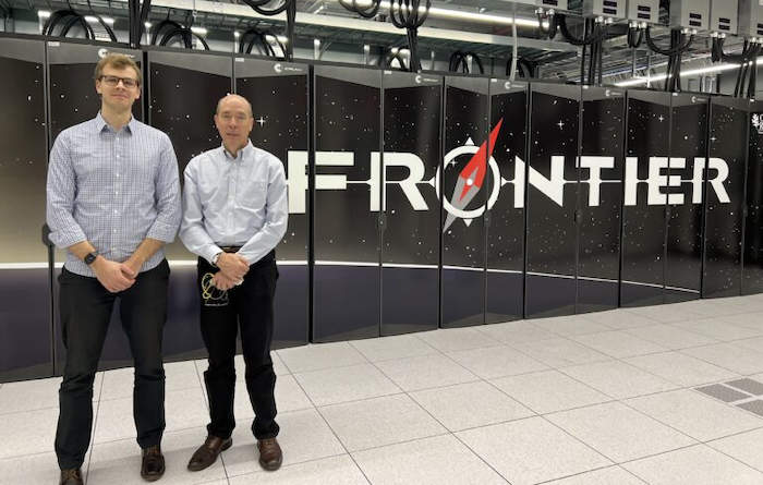 York University Assistant Professor Miles Couchman (left) and collaborator Professor Steve de Bruyn Kops (right) in front of the Frontier Supercomputer at the Oak Ridge National Laboratory, the largest supercomputer in the world.