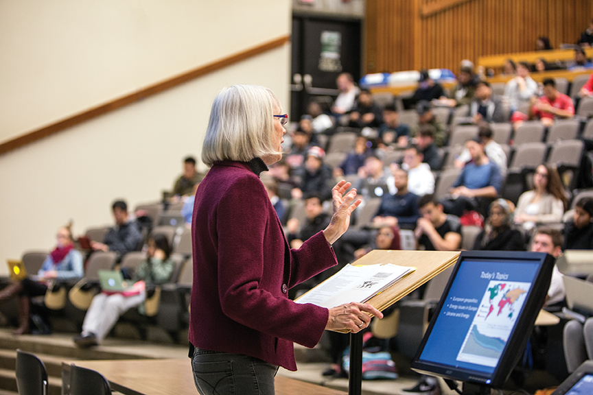 Photo of a professor lecturing in a classroom