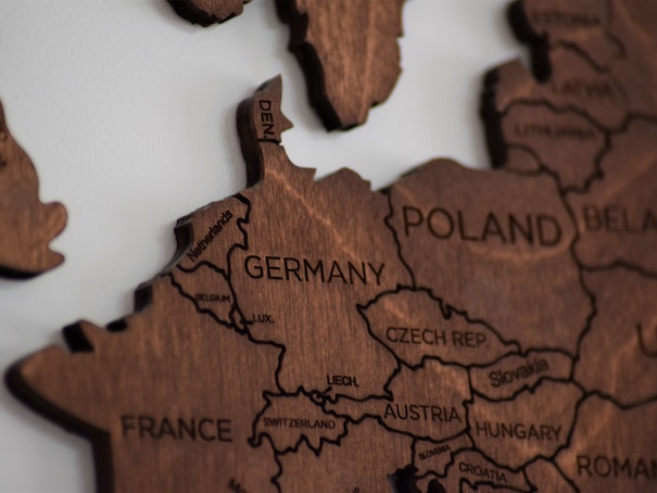 Close-Up Photo of Wooden Jigsaw Map