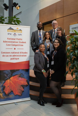 Group photo of case study team on staircase