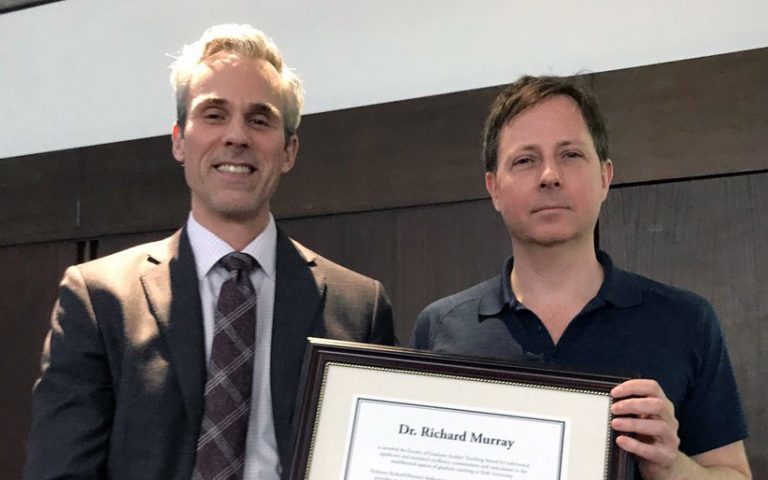 GS Dean Thomas Loebel (left) presents the Faculty of Graduate Studies Teaching Award to Professor Richard Murray (right)