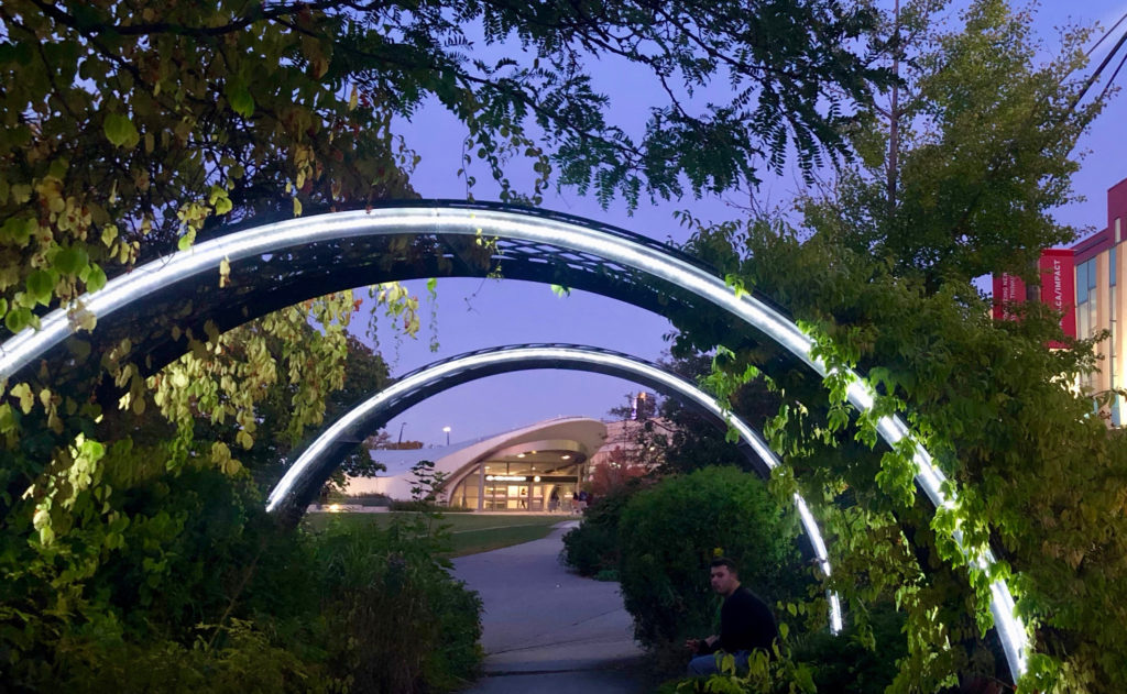 photo of the arch-covered walkway on the south side of the Commons