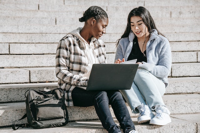 Concentrated students doing assignment together