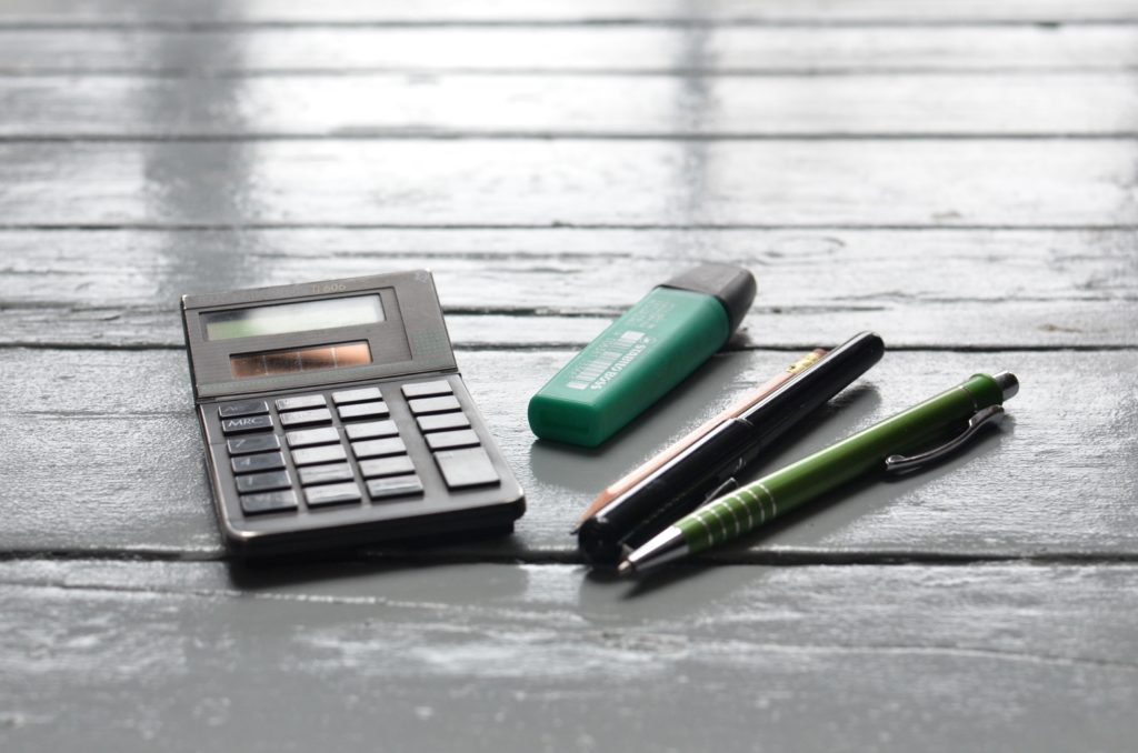 Image of a calculator and pens