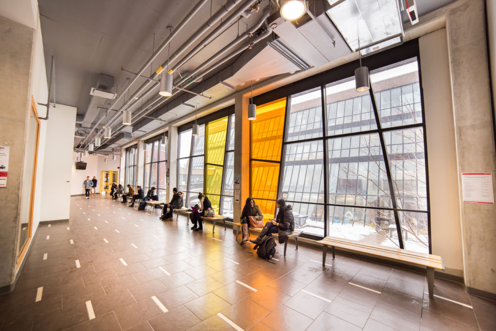 Students chatting inside a YorkU building