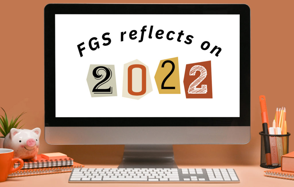 computer on a desk with the words "FGS reflects on 2022" on the computer screen