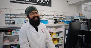 Photo of a positive pharmacist with a beard
