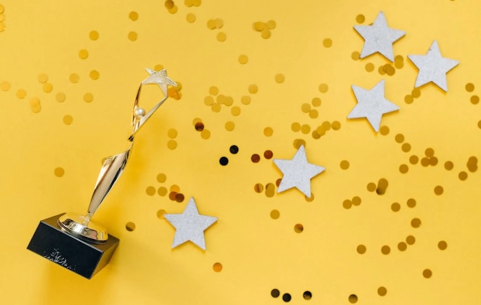 image with stars, confetti and a trophy